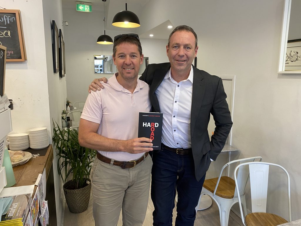 Lessons for Emerging Leaders. Martin presents Brendan with his new book - Hard Road. A Leader's Journey Begins